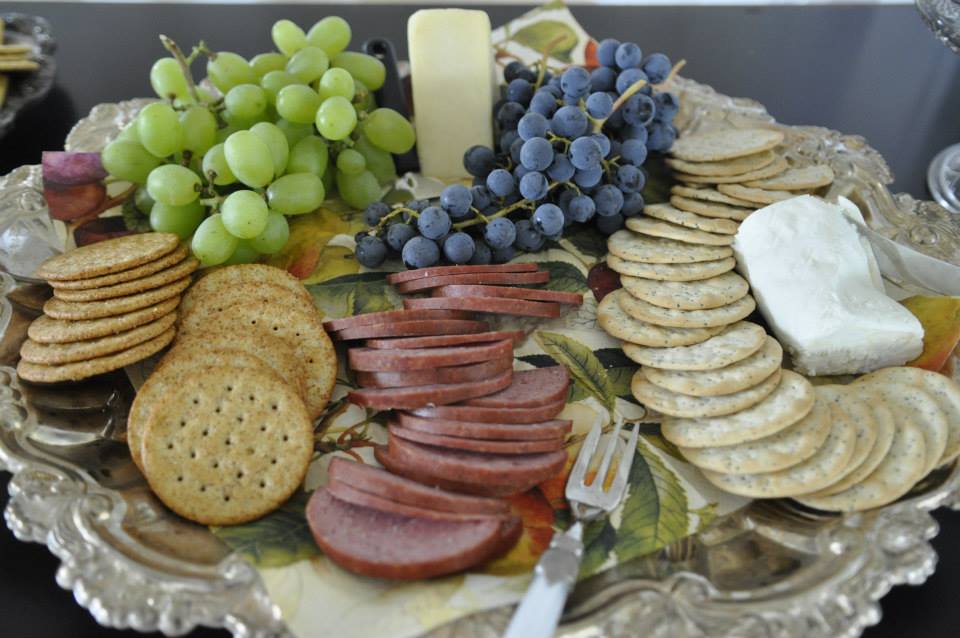 Tips for how to create an eloquent and edible cheese and wine tray for parties and gatherings!