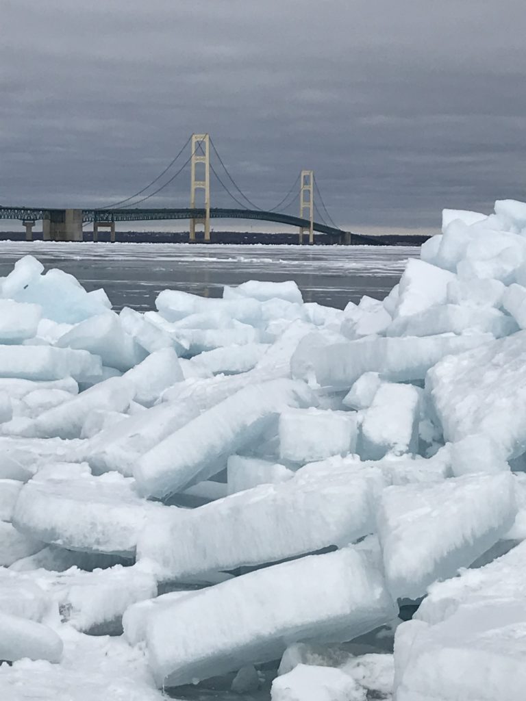 Blue ice with mackinaw bridge