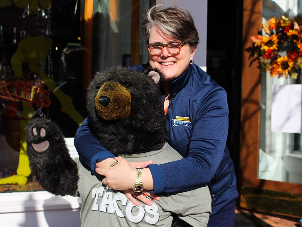 National Hug a Bear Day - Jennifer Shorter hugs Carlos the Bear at Grandpa Shorters in Petoskey