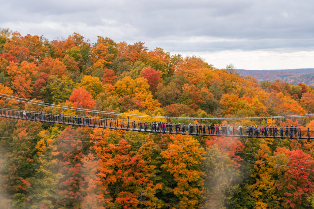 People cross SkyBridge, Michigan's Second Bridge in Northern Michigan.