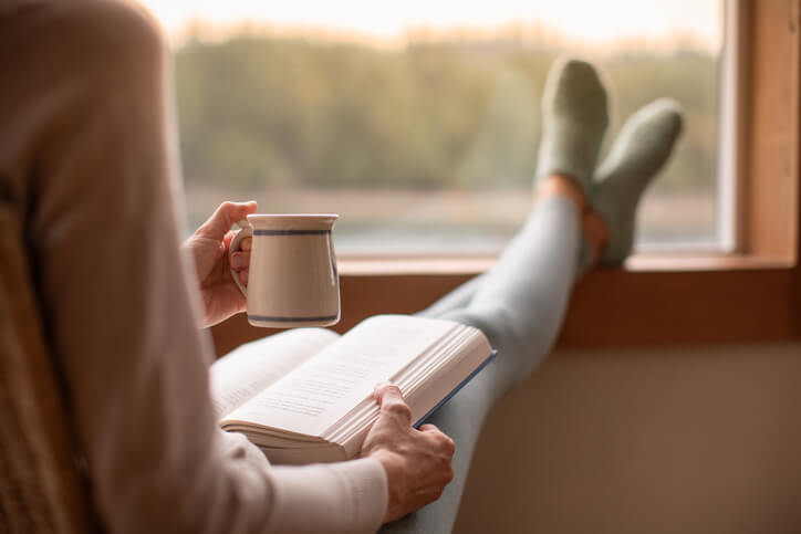 Woman relaxing reading book